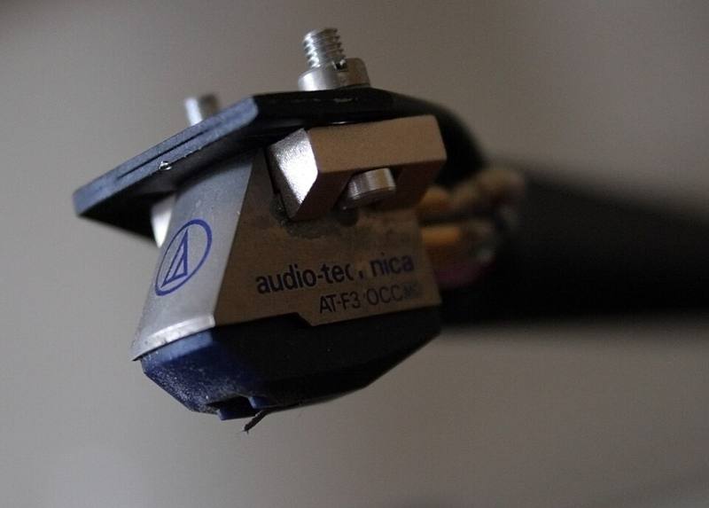 Close-up of a phono cartridge and stylus