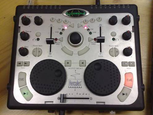 A two-deck DJ controller with jog wheels and pads